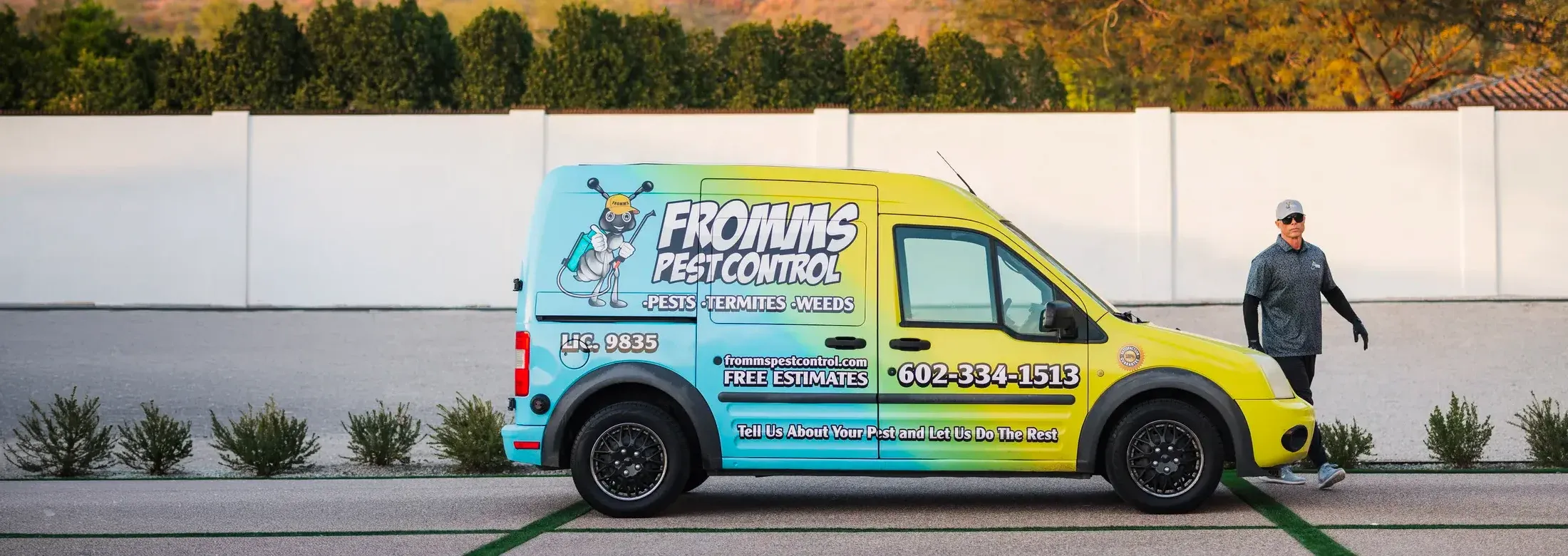 Fromms Pest Control Technician walking near van