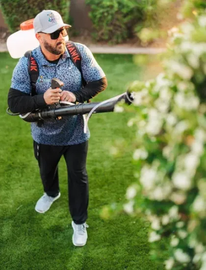 technician spraying for mosquitoes